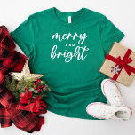 Merry and Bright Modern Green Women's Christmas T-Shirt<br><div class="desc">A festive Christmas graphic tee for women featuring modern lowercase script typography with "Merry and Bright" saying. White text and green tshirt style can both be modified.</div>