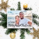 Merry Beachy Christmas fun vacation photo  Holiday Card<br><div class="desc">Share your favorite beach vacation picture with this fun and modern beach Christmas photo card featuring a trendy hand-lettered typography overlay that reads "Merry Beachy Christmas" decorated with waves, sun, and surfboard illustrations. Easily personalizable with one of your favorite holiday pictures and your names. The back of the card features...</div>
