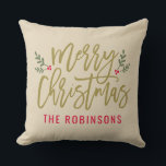 Merry Christmas Beige Modern Custom Family Throw Pillow<br><div class="desc">Seasonal pillow design features a modern antique gold script "Merry Christmas" with red custom text that can be personalized with your last name. Green branches of holly leaves and red berries accent the design. Neutral beige background color.</div>