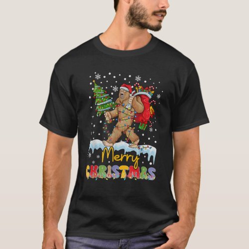 Merry Christmas Bigfoot Carrying Christmas Tree T_Shirt