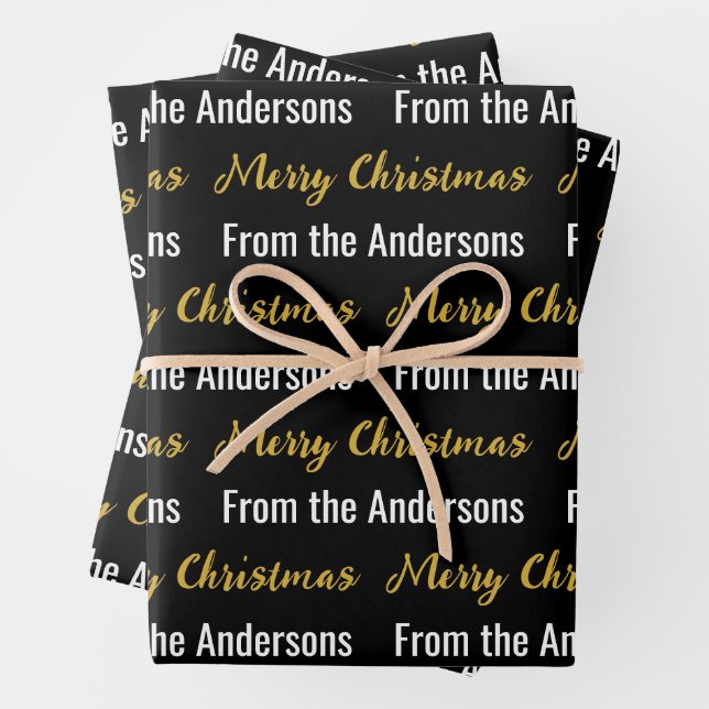 Merry Christmas Black White and Gold Script Name Wrapping Paper Sheets (In situ)