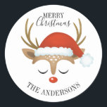 Merry Christmas Cute Reindeer Classic Round Sticker<br><div class="desc">A cute reindeer face with a santa hat decorates this sticker with the words Merry Christmas. Fun for decorating Christmas gifts and holiday treat bags for neighbors. Personalize it with your name. Designed for you by Blackberry Boulevard.</div>