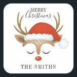 Merry Christmas Cute Reindeer Square Sticker<br><div class="desc">A cute and whimsical reindeer face with a Santa hat decorates this square sticker with the words Merry Christmas. Fun for your holiday gifts. Personalize it with your name. Designed for you by Blackberry Boulevard.</div>