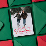 Merry Christmas elegant one photo red Holiday Card<br><div class="desc">"Merry Christmas" in a red elegant type treatment sits atop of a single vertical photo. This classic card is the perfect way to send Christmas greetings to friends and family. The back is a festive red speckled with a snowy pattern. The red color can be changed by clicking "customize further."...</div>