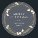 Merry Christmas Family Name Winter Greenery  Class Classic Round Sticker<br><div class="desc">Merry Christmas sticker with your family name in elegant modern typography and a classic stylish winter greenery wreath with cotton sprigs and white floral on a charcoal dark blue background. Simply add your name. Exclusively designed for you by Happy Dolphin Studio. If you need any help or matching products please...</div>
