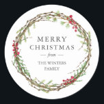 Merry Christmas Family Name Winter Greenery  Classic Round Sticker<br><div class="desc">Merry Christmas sticker with your family name in elegant modern typography and a classic stylish winter greenery wreath with red berries. Simply add your name. Exclusively designed for you by Happy Dolphin Studio. If you need any help or matching products please contact us through our store.</div>