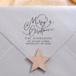 Merry Christmas Flourish Return Address Self-inking Stamp<br><div class="desc">This self-inking Christmas stamp features "Merry Christmas" written in chic hand-lettering. The text is decorated with elegant calligraphy flourishes. There is a cute little heart. Your family name appears below in classic serif typography. Your return address appears at the bottom in simple sans serif typography. Made to match our Joyful...</div>