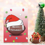 Merry Christmas Football With Santa Hat Card<br><div class="desc">This is a wonderful Christmas card for the football lover! You can customize and personalize the inside message!</div>