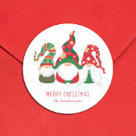 Merry Christmas Gnomes Cute Personalized Classic Round Sticker<br><div class="desc">Cute personalized holiday mailing or gift wrapping stickers featuring three Scandinavian-style gnomes with a seasonal red and green hats. You can easily personalize the "Merry Christmas" greeting and your name at the bottom.</div>