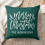 Merry Christmas Green Modern Custom Family Throw Pillow<br><div class="desc">Seasonal pillow design features a modern brushed script "Merry Christmas" with white custom text that can be personalized with your last name. Illustrated branches of holly leaves and berries accent the design. Emerald green background color can be modified.</div>