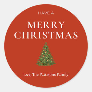 Merry Christmas greeting with tree on red custom Classic Round Sticker