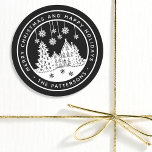 Merry Christmas Happy Holidays Winter Personalized Classic Round Sticker<br><div class="desc">Merry Christmas Happy Holidays Winter Personalized Name Stickers Labels features the text "Merry Christmas and Happy Holidays" in modern white script on a black background and personalized with your name surrounding a home with Christmas trees and snowflakes. Perfect for Christmas party favors and Holiday gifts or in the office for...</div>