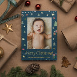 Merry Christmas Modern Scandi Blue Custom photo Foil Holiday Card<br><div class="desc">Show off a memorable family photo by customizing the picture on this Modern Merry Christmas holiday card, dark blue background with scandi illustration art of pine, stars and rainbows. Real gold foil enhance the look of this card. Send a special card this season with your family name and year. Spread...</div>