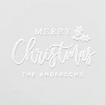 Merry Christmas Modern Script Holly Embosser<br><div class="desc">Flowing Merry Christmas calligraphy is paired with a sweet holly sprig and clean block family name in this festive modern script embosser. The mix of script and serif lettering gives it a polished holiday feel perfect for card mailings and gift wrap. Personalize with your family name. A lovely Christmas gift...</div>