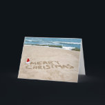 Merry Christmas on beach Holiday Card<br><div class="desc">Santa hat on the beach for Merry Christmas.</div>