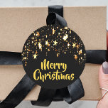 Merry Christmas on black with shining stars Classic Round Sticker<br><div class="desc">A black background with a cascade of golden shining stars,  a bit of bling and luxury for Christmas.  Golden letter and the text: Merry Christmas!</div>