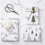 Merry Christmas Pine Trees Wrapping Paper Sheets<br><div class="desc">Beautiful and elegant black and white Merry Christmas wrapping paper with a bit of forest green is perfect for those who like a simple and minimalist aesthetic and a little bit of of color. The pine Christmas trees have a tiny gold star. So pretty with the hand written script typography....</div>