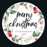 Merry Christmas Red Berry Wreath Classic Round Sticker<br><div class="desc">Add a sprinkle of artistry to your festive season with our enchanting personalized Christmas circle sticker. Lovingly crafted, each sticker showcases a mesmerizing watercolor Christmas wreath, capturing the delicate hues and whimsy of the holiday spirit. Central to this artistic creation, the phrase “Merry Christmas” is elegantly penned in modern script,...</div>