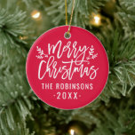 Merry Christmas Red Script Custom Family Photo Ceramic Ornament<br><div class="desc">Stylish Merry Christmas holiday ornament features white script writing and accents of branches with holly leaves and berries. Personalize with custom name / family and year text,  and add a favorite family photo to the opposite side. The crimson red background color can be modified.</div>