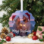 Merry Christmas Romantic Couple Sunset Photo Ornament Card<br><div class="desc">This romantic holiday design features a couple photo area under soft Merry Christmas script in a warm sunset setting. The Santa hats, glowing sparklers, and cozy winter colors give the design a festive and intimate look. The photo area is for adding your own picture, and the text can be changed...</div>