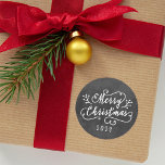 Merry Christmas Rustic Black Chalkboard Script Classic Round Sticker<br><div class="desc">Merry Christmas holiday photo stickers feature a modern white script overlay with berry branches,  custom year text,  and a rustic black chalkboard textured background design.</div>