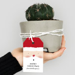 Merry Christmas Santa Cute Fun Personalized Name Gift Tags<br><div class="desc">Merry Christmas Santa Cute Fun Personalized Name Gift Tags. This modern design features a cute Santa face with Santa hat and your personalized message and name at the base. Personalize by editing the text in the text box provided. Created by Evco Holidays www.zazzle.com/store/evcoholidays</div>