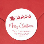 Merry Christmas Santa Reindeer Return Address Classic Round Sticker<br><div class="desc">Fun seasonal sticker for your Christmas holiday cards and correspondence featuring a red silhouette of reindeers flying Santa's sleigh through air,  "Merry Christmas" in a stylish red script and your family name and address in simple modern red typography.</div>