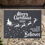 Merry Christmas Santa's sleigh reindeers holiday Doormat<br><div class="desc">Show how much you believe in the magic of Christmas and Santa Claus with this dark grey Christmas doormat featuring the silhouette of Santa's sleigh in white with his reindeers, flying in a trail of stars. The caption on top reads Merry Christmas in white handwritten lettering. The text is easily...</div>