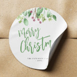 Merry Christmas script simple modern elegant Classic Round Sticker<br><div class="desc">Modern stylish Merry Christmas green handwritten typography script simple gift label round sticker with your name featuring watercolor botanical greenery and holy berries.</div>