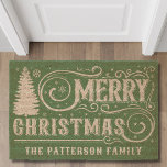 Merry Christmas Tree Typography Personalized Name Fiber Doormat<br><div class="desc">Merry Christmas Tree Typography Personalized Name Holiday Coir Doormat features the text "Merry Christmas" in elegant calligraphy script typography accented a Christmas tree and personalized with your custom name at the base. Perfect for Christmas decor. Created by Evco Studio www.zazzle.com/store/evcostudio</div>