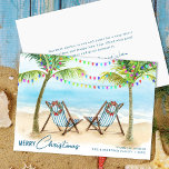 Merry Christmas Tropical Beach Palm Trees Holiday Card<br><div class="desc">Send warm holiday wishes with this tropical Christmas card featuring palm trees decorated with colorful string lights and two striped beach chairs adorned with festive wreaths by the ocean. Perfect for coastal families,  beach lovers,  or anyone celebrating Christmas in the sun.</div>