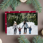 Merry Christmas Whimsical Gold Script Photo Foil Holiday Card<br><div class="desc">Cute holiday photo card with "Merry Christmas" featured at the top of the card in a handwritten gold foil script. Personalize the whimsical Christmas card with your horizontal photo and family name. The card reverses to a cranberry and white snowflake pattern.</div>