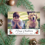 Merry Christmas Winter Florals Photo Holiday Card<br><div class="desc">Merry Christmas photo holiday card featuring your photo,  "Merry Christmas" in a contemporary script,  your family name in simple modern typography and watercolor bouquets of poinsettia flowers and winter greenery.</div>