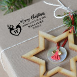 Merry Christmas with love from (custom) Family  Rubber Stamp<br><div class="desc">This christmas design features a couple of reindeer with a monogram and a family name.
Perfect for a family to mark presents.</div>
