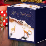 Merry Christmas - wood deers and mountains in snow Favor Boxes<br><div class="desc">Celebrate the season with this enchanting gift box adorned with my Fantabuloustef artwork. Featuring three wooden deer in a snowy Christmas night scene, nestled near a wooden mountain, it's a true winter wonderland. "Merry Christmas" is elegantly written in shimmering golden calligraphy, adding a touch of festive magic. Perfect for bringing...</div>