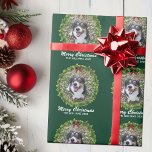Merry Christmas Wreath Custom Dog Photo Green Wrapping Paper<br><div class="desc">Beautiful custom pet Christmas wrapping paper featuring a green holiday wreath on festive gift wrap. Replace with your cute dog's photo in the center of the wreath or add a pretty personalized cat picture for your friends and family. Merry Christmas is written in white. Customize with your own text underneath....</div>