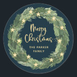 Merry Christmas Wreath with Gold Stars on Blue Classic Round Sticker<br><div class="desc">These trendy and stylish Christmas stickers feature a pretty,  watercolor Christmas wreath with gold colored star accents and lights,  with modern script calligraphy that says "Merry Christmas" on a dark,  navy blue background.</div>