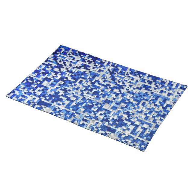 Mess of small squares, shades of blue with white cloth placemat (On Table)