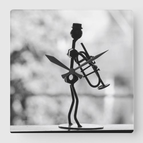 Metal art stick man with trumpet wall clock