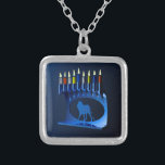 Metallic Blue Chanukkah Menorah Silver Plated Necklace<br><div class="desc">A modernistic,  metallic,  blue Chanukkah menorah,  featuring a lion in silhouette,  against a dark,  night-like background. All nine of the candles are lit.</div>