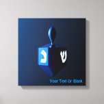Metallic Blue Dreidel Canvas Print<br><div class="desc">A modernistic,  metallic blue dreidel against a dark,  night-like background.  Two of the Hebrew letters found on a dreidel,  nun and shin,  glow brightly.  Add your own text.</div>