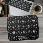 Metallic Flowers Black, Silver Floral Pattern Name Laptop Sleeve<br><div class="desc">This personalized laptop sleeve features metallic look flowers and leaves that pop out on the black background. The pearl like beads make this a unique modern design that makes a statement. To change the name click on the personalize button. A.I. is used in this design.</div>
