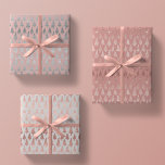 Metallic Rose Gold Platinum Silver Christmas Trees Wrapping Paper Sheets<br><div class="desc">This assortment of holiday wrapping paper sheets features simulated metallic glitter faux foil ornate christmas pine tree silhouettes in rose gold and platinum silver scattered over a beautiful solid tones of mauve,  rose quartz pink,  and platinum grey</div>