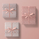 Metallic Rose Gold Platinum Silver Christmas Trees Wrapping Paper Sheets<br><div class="desc">This assortment of holiday wrapping paper sheets features simulated metallic glitter faux foil ornate christmas pine tree silhouettes in rose gold and platinum silver scattered over a beautiful solid tones of mauve,  rose quartz pink,  and platinum grey</div>