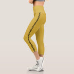 MetallicGold Capri Leggings with Black Side Stripe<br><div class="desc">Turn heads with these metallic gold capri leggings, accented by a sleek black side stripe. The cropped length and bold contrast offer a perfect mix of edgy style and comfortable wear. Ideal for workouts, dance, or making a striking fashion statement on the go.</div>