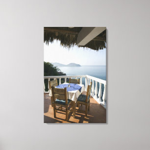 Mexico, Guerrero, Zihuatanejo. Cafe Table over Canvas Print
