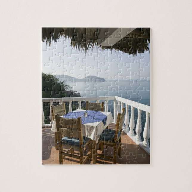 Mexico, Guerrero, Zihuatanejo. Cafe Table over Jigsaw Puzzle (Vertical)