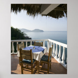 Mexico, Guerrero, Zihuatanejo. Cafe Table over Poster
