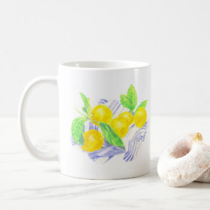 Meyer lemons on kitchen towel coffee mug