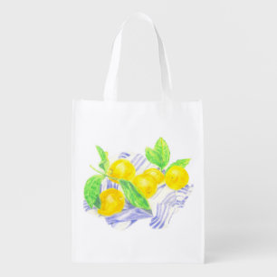 Meyer lemons on kitchen towel grocery bag